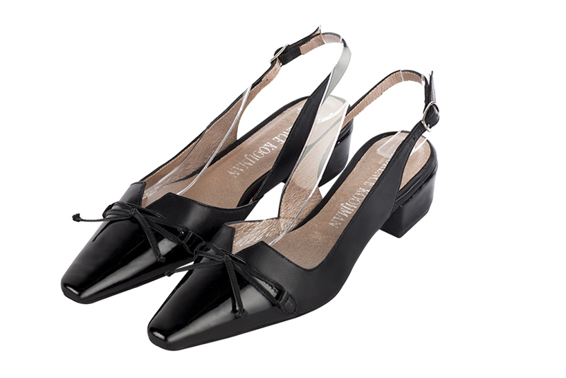Dress slingback bow heels in gloss black and satin black leather with low block heels and tapered toe - Front view